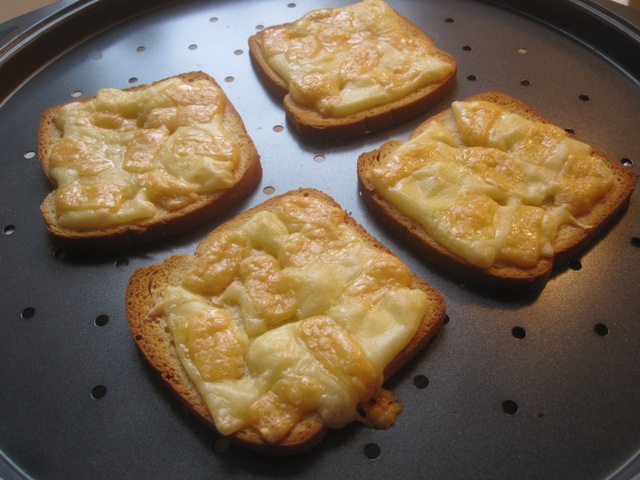The darker-colored cheese is the Beemster.