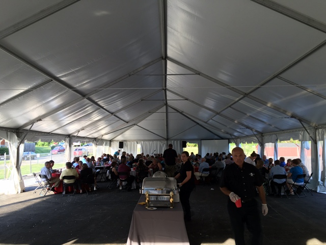 The banquet was in a tent on the site of the field house that collapsed from snow this past winter.