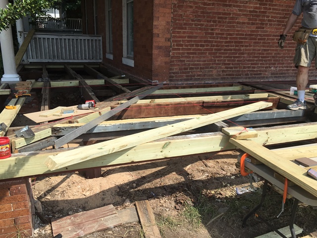 It was careful work.  The joists had to be centered and flush with the surrounding joists.